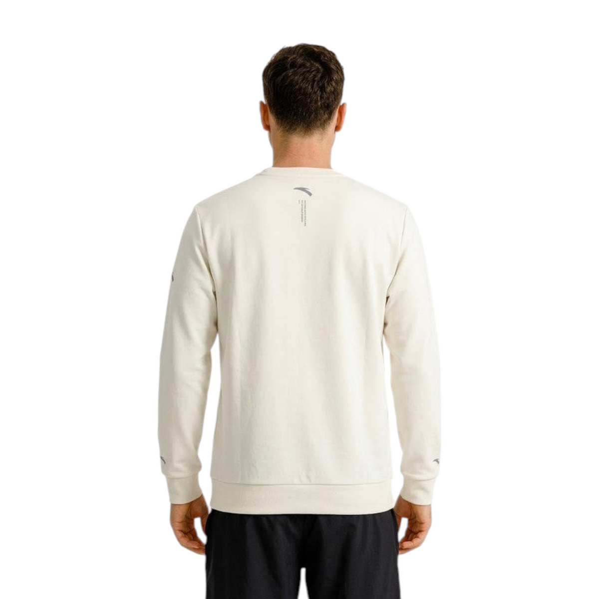 Back view of a man wearing a grey FRG ANTA Light Travel sweatshirt with ribbed cuffs and hem.
