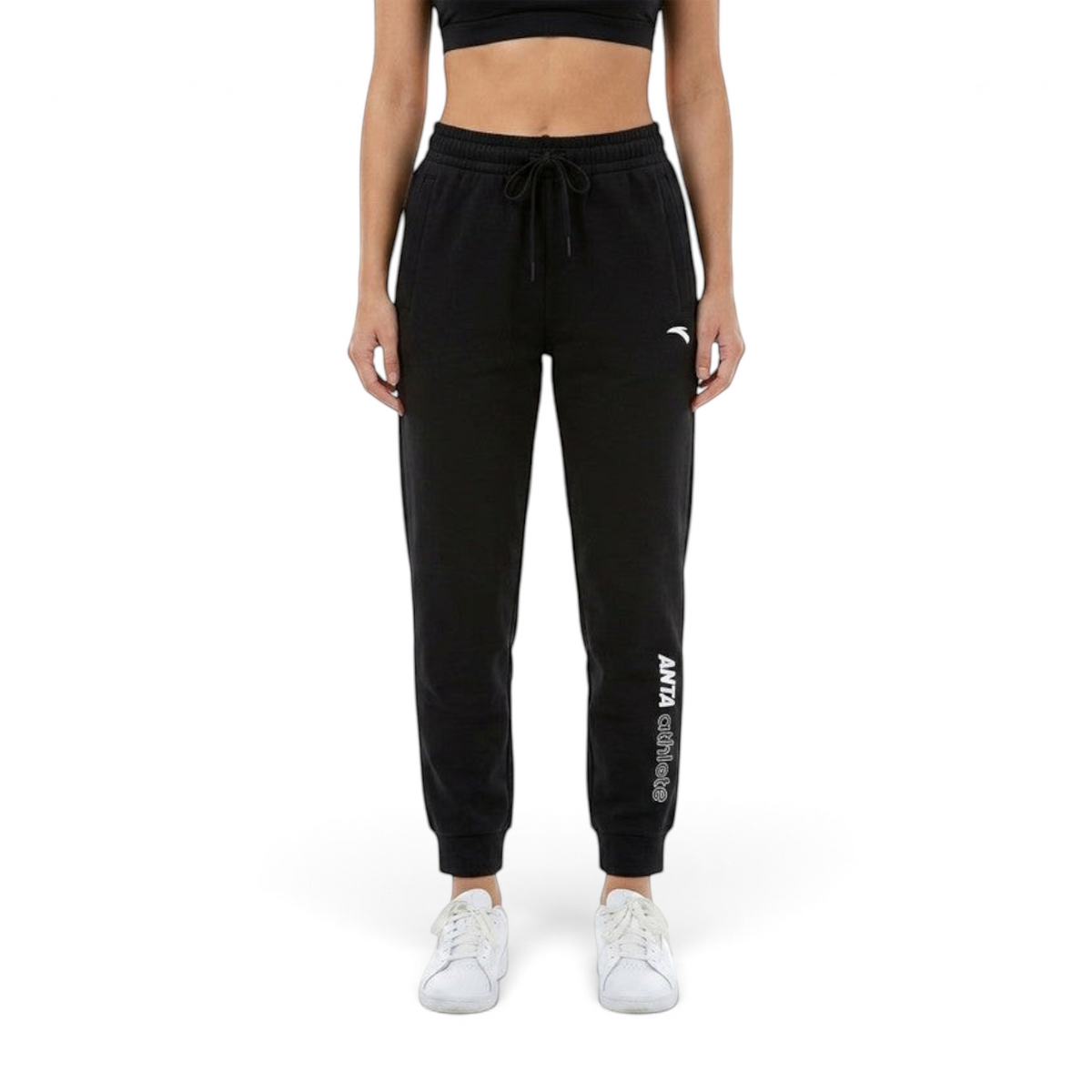 FRG ANTA black knit track pants with tapered fit, drawstring waist, and white logo branding on the leg