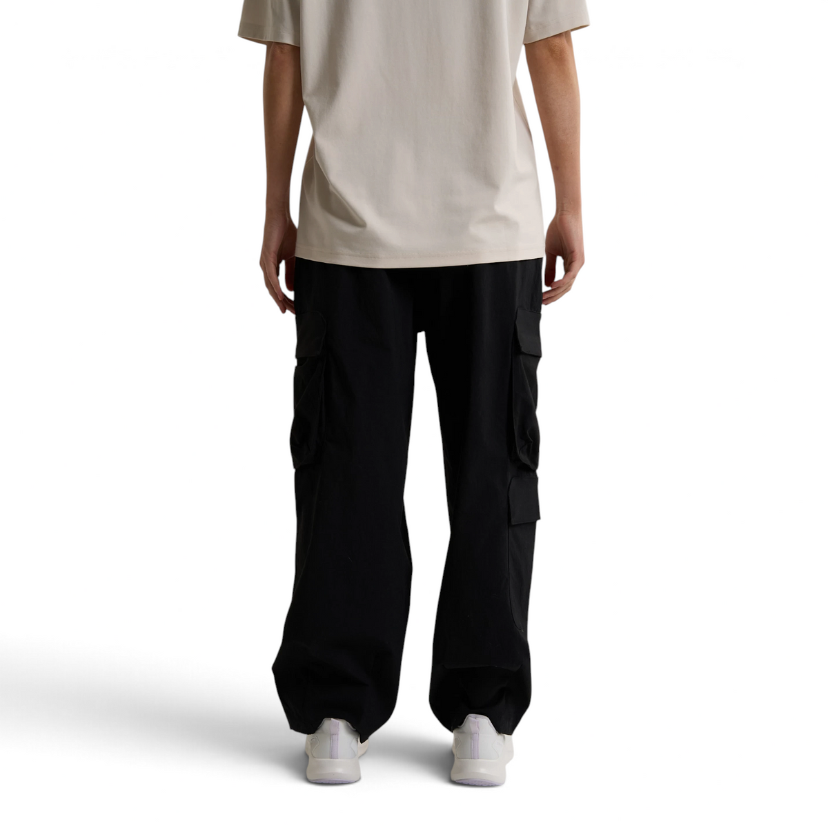 FRG ANTA black woven casual cargo pants with side pockets worn by a person in a beige t-shirt and white sneakers