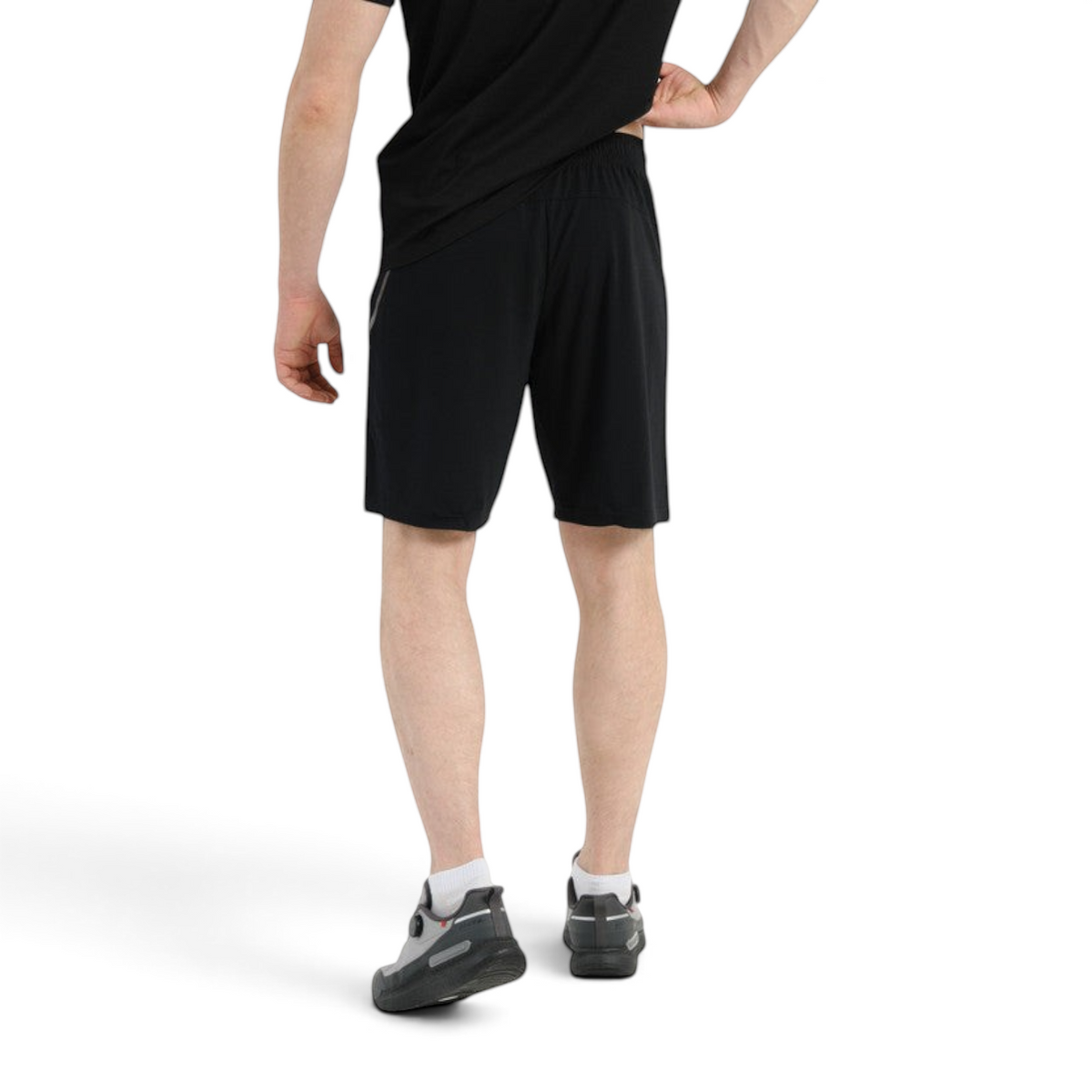 Back view of a man wearing FRG Anta Knit Half Pants TRN in black, featuring a regular fit for functional training.