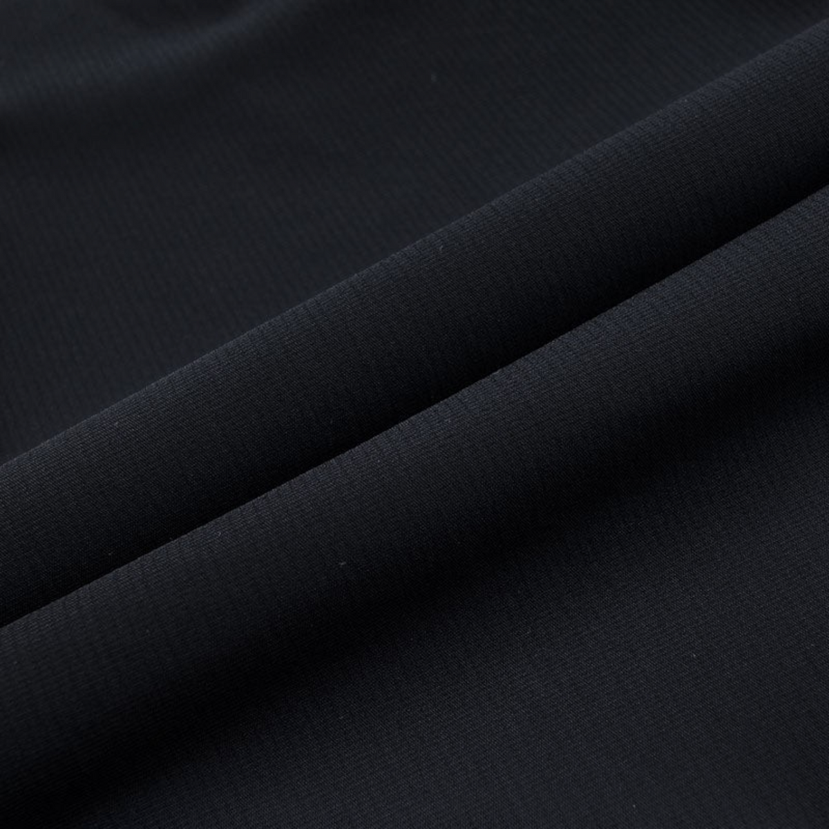 FRG ANTA Splash Express black knit track pants fabric detail showing smooth texture and flexible material