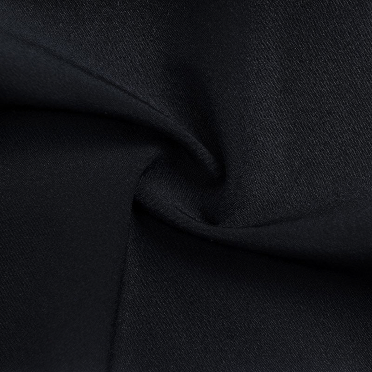 Close-up of black FRG ANTA Splash Express knit fabric showing the smooth, flexible texture of the performance material.