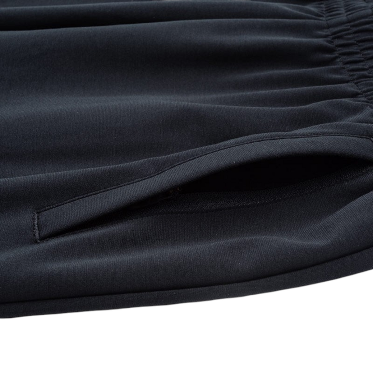 FRG ANTA Sorona knit track pants in black featuring a secure zippered side pocket and elasticated waistband