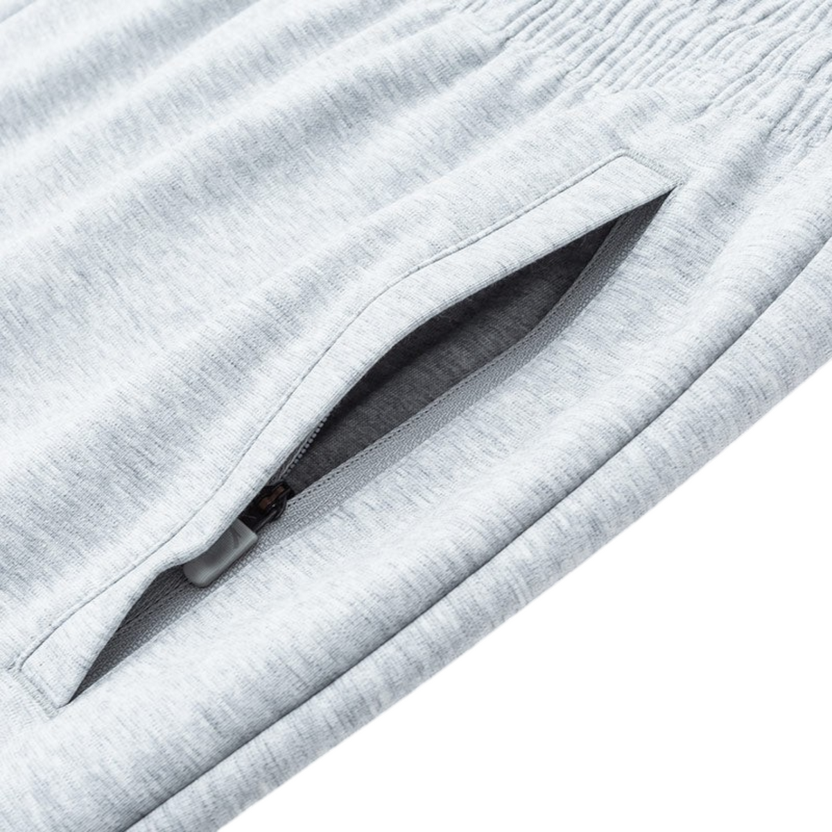 FRG ANTA Sorona knit track pants in heather grey featuring a secure zippered side pocket and elasticated waistband.