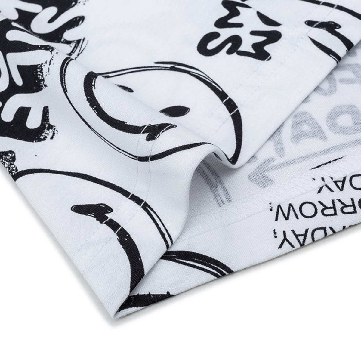 FRG white short sleeve t-shirt featuring a black graphic print of smiley faces and text in a casual style