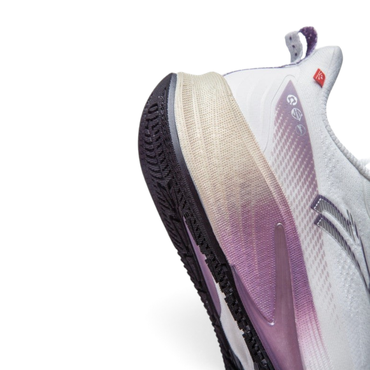 Close-up of the heel and sole of FRG ANTA Rocket 6 running shoes in white and purple with NITROEDGE cushioning.