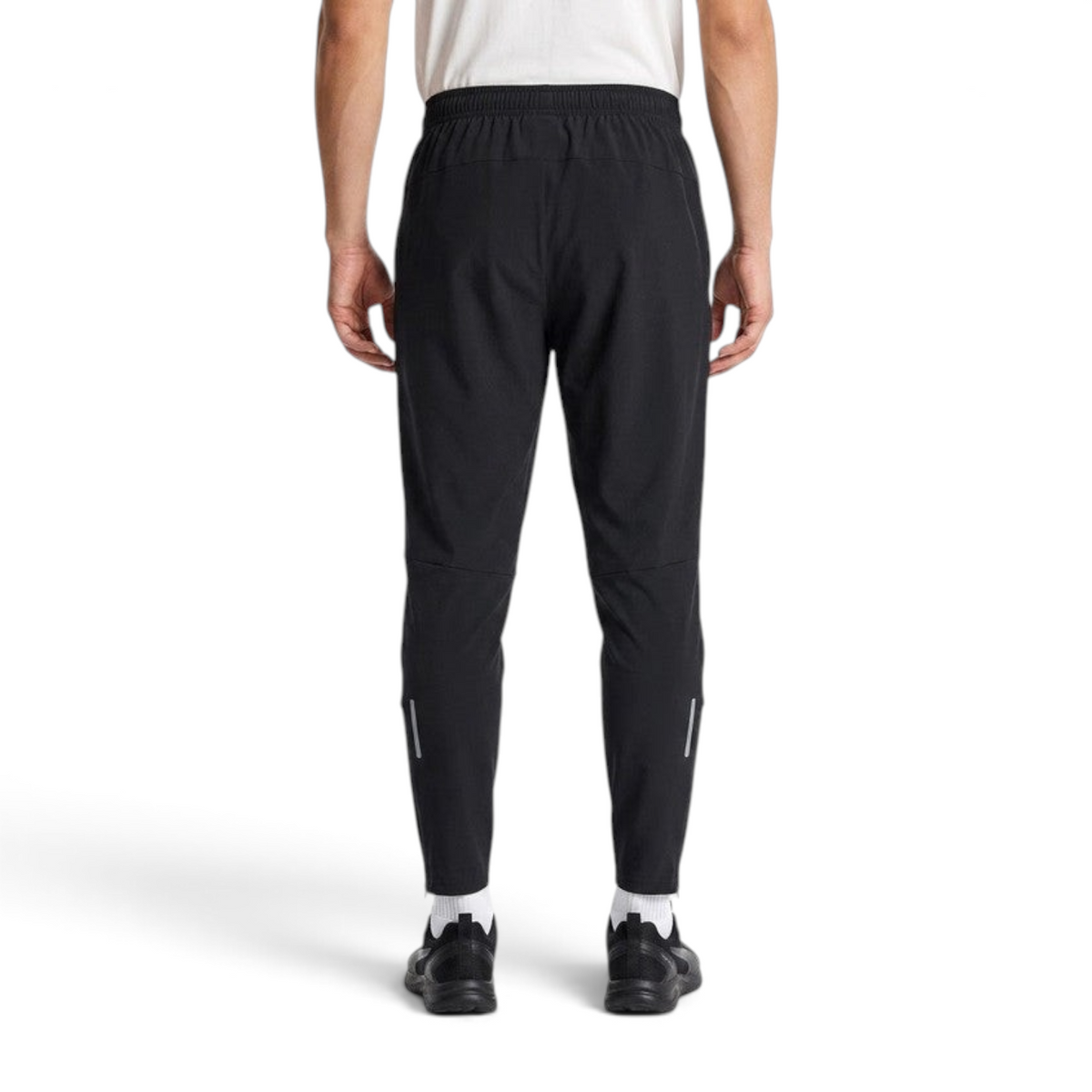 FRG ANTA black woven ankle running pants on a model, featuring a lightweight, breathable, and stretchy fit.
