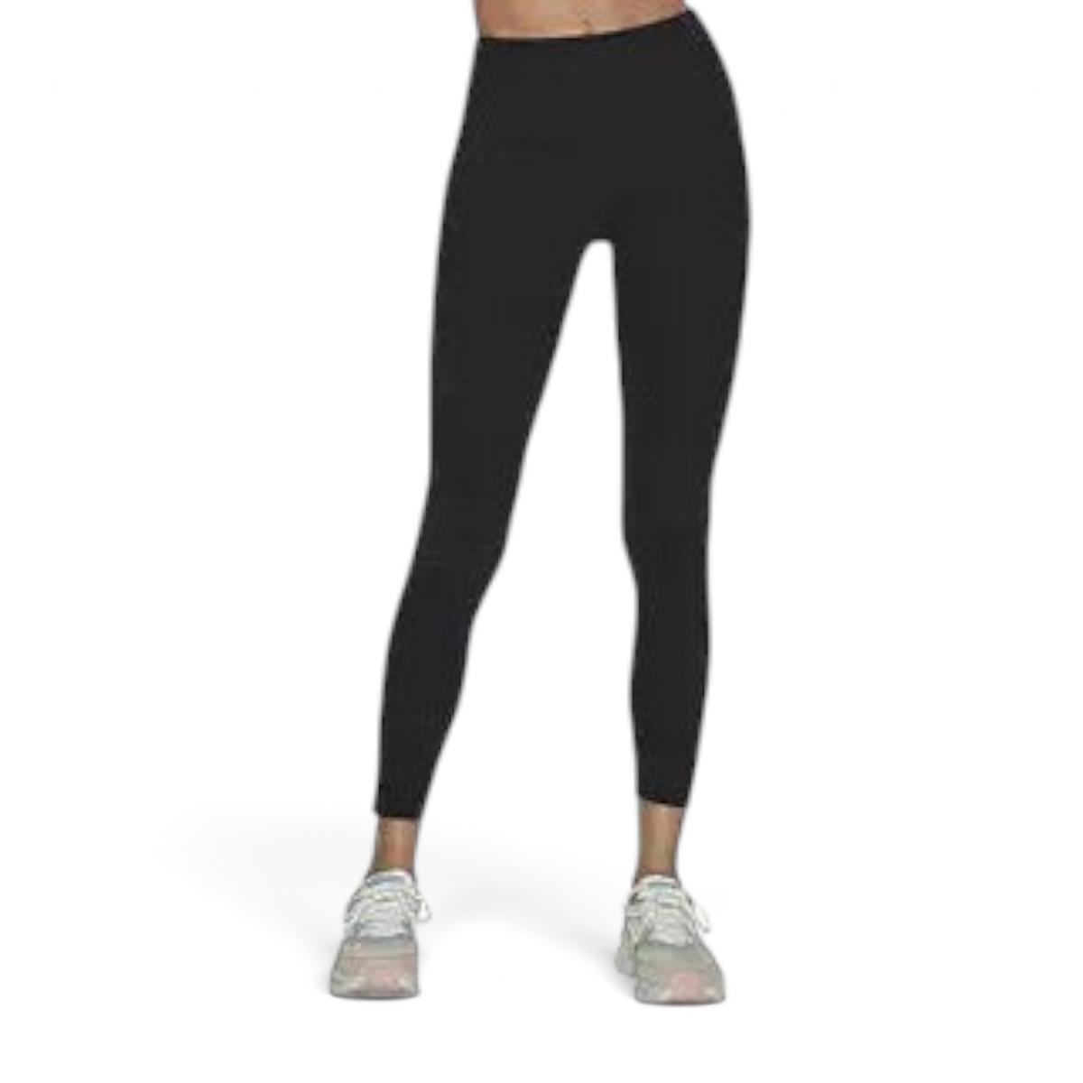FRG black high-waisted leggings with a scalloped waistband detail worn with white athletic sneakers
