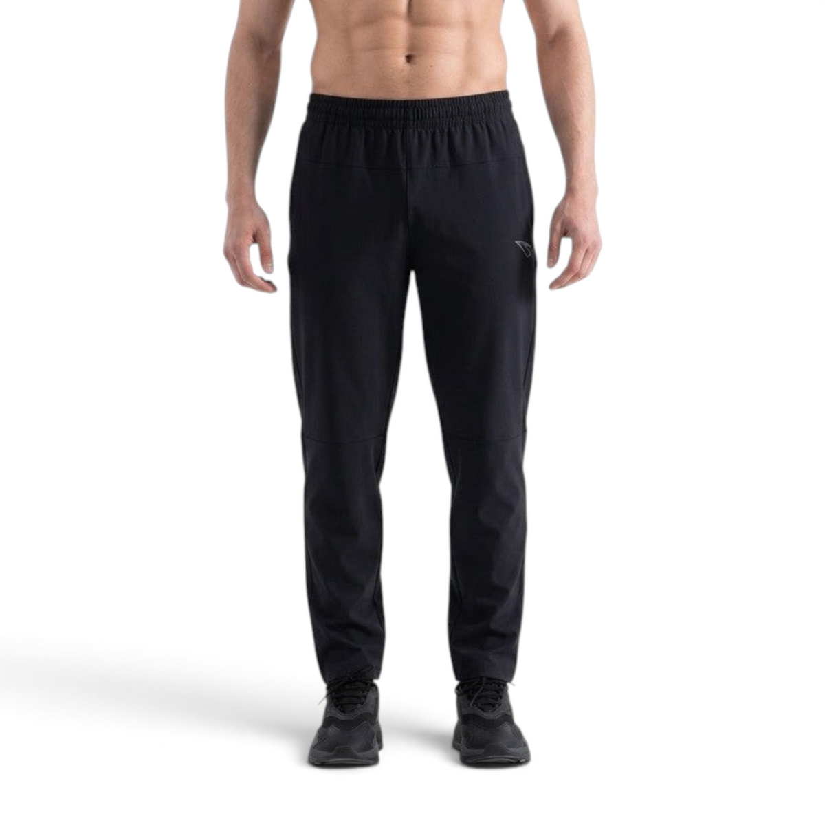 FRG ANTA men's black knit ankle pants with a tapered fit and elastic waistband worn by a shirtless model