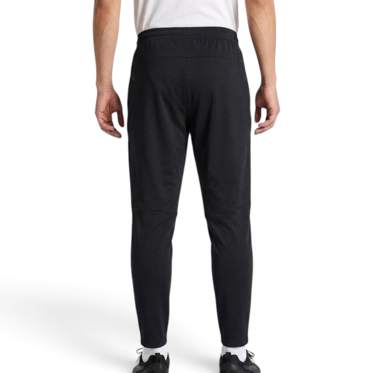 FRG ANTA men's black knit ankle pants with a tapered fit, viewed from the back on a model.