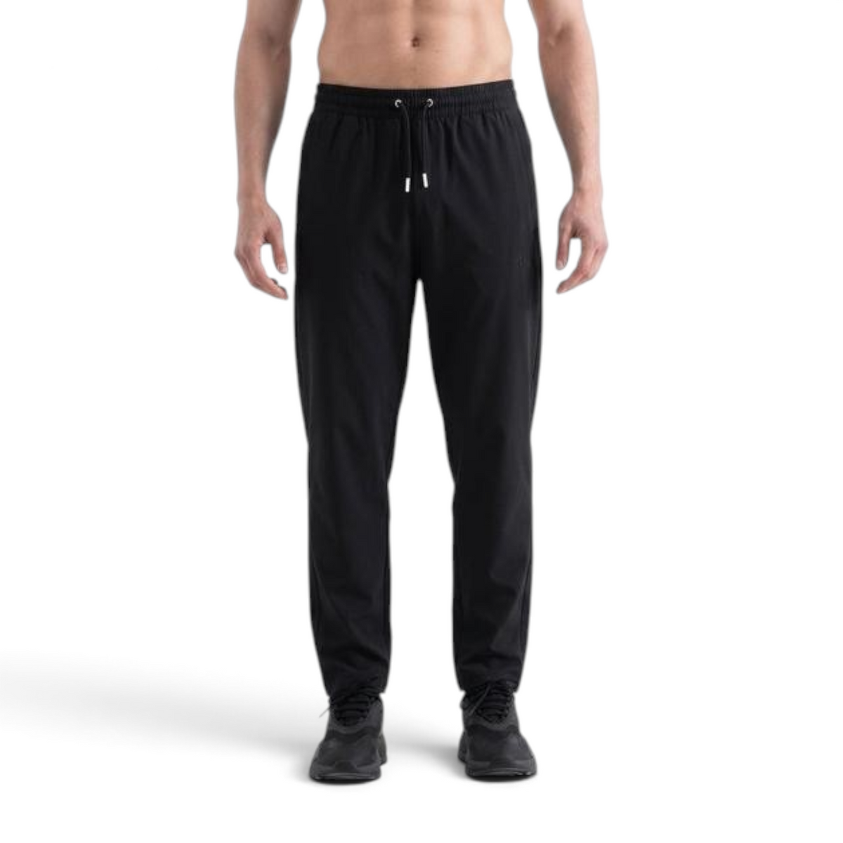 FRG ANTA A-Chill Touch black athletic ankle pants on a man, featuring a drawstring waist and lightweight fabric.