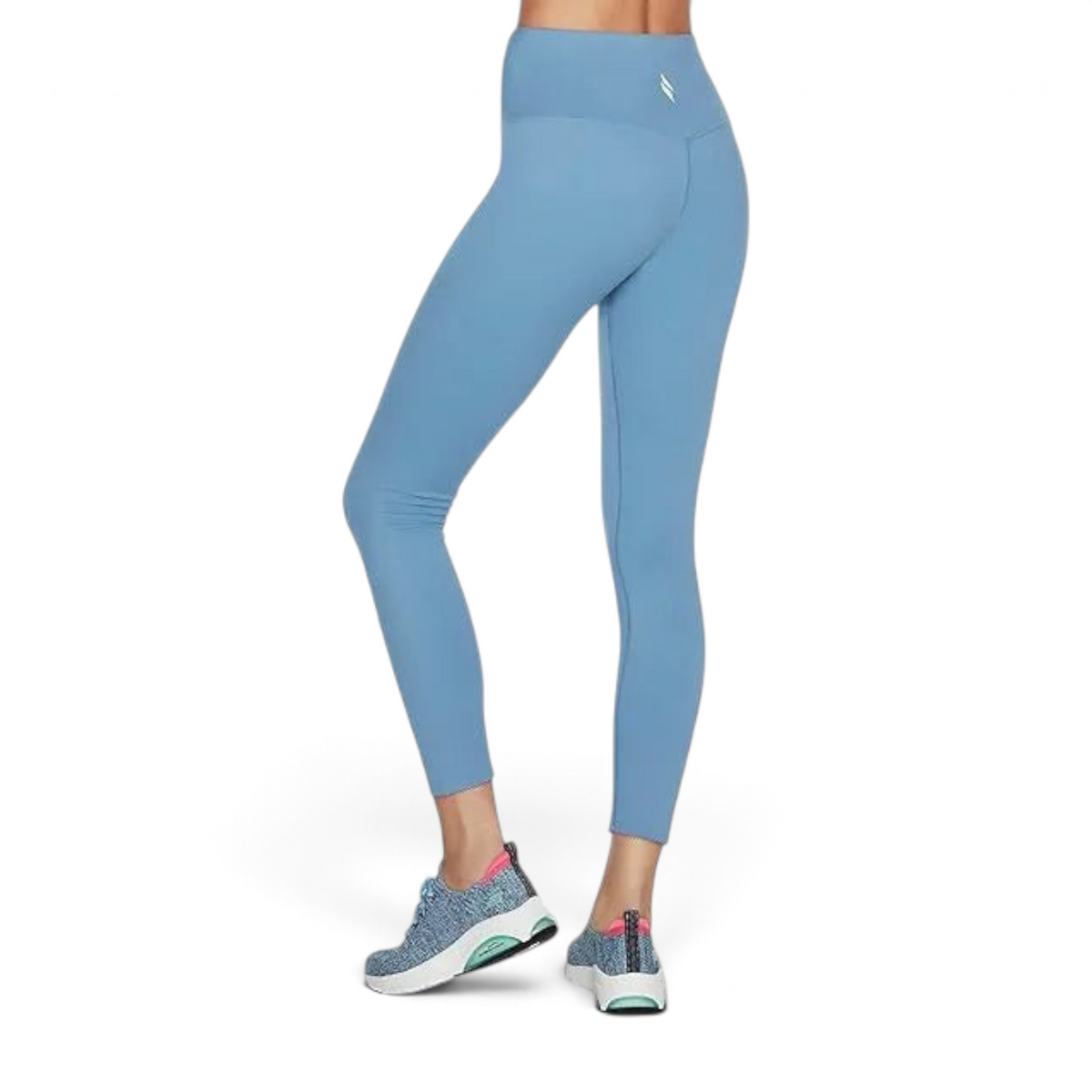 FRG blue high-waisted 7/8 leggings with a scalloped front detail worn by a model with patterned athletic sneakers.
