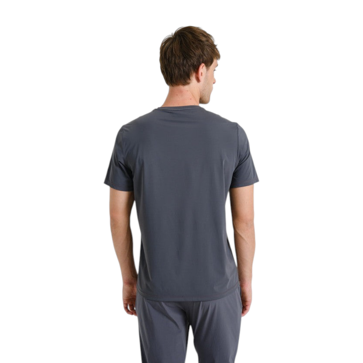 Back view of a man wearing a grey FRG ANTA short sleeve running t-shirt made from breathable moisture-wicking fabric.