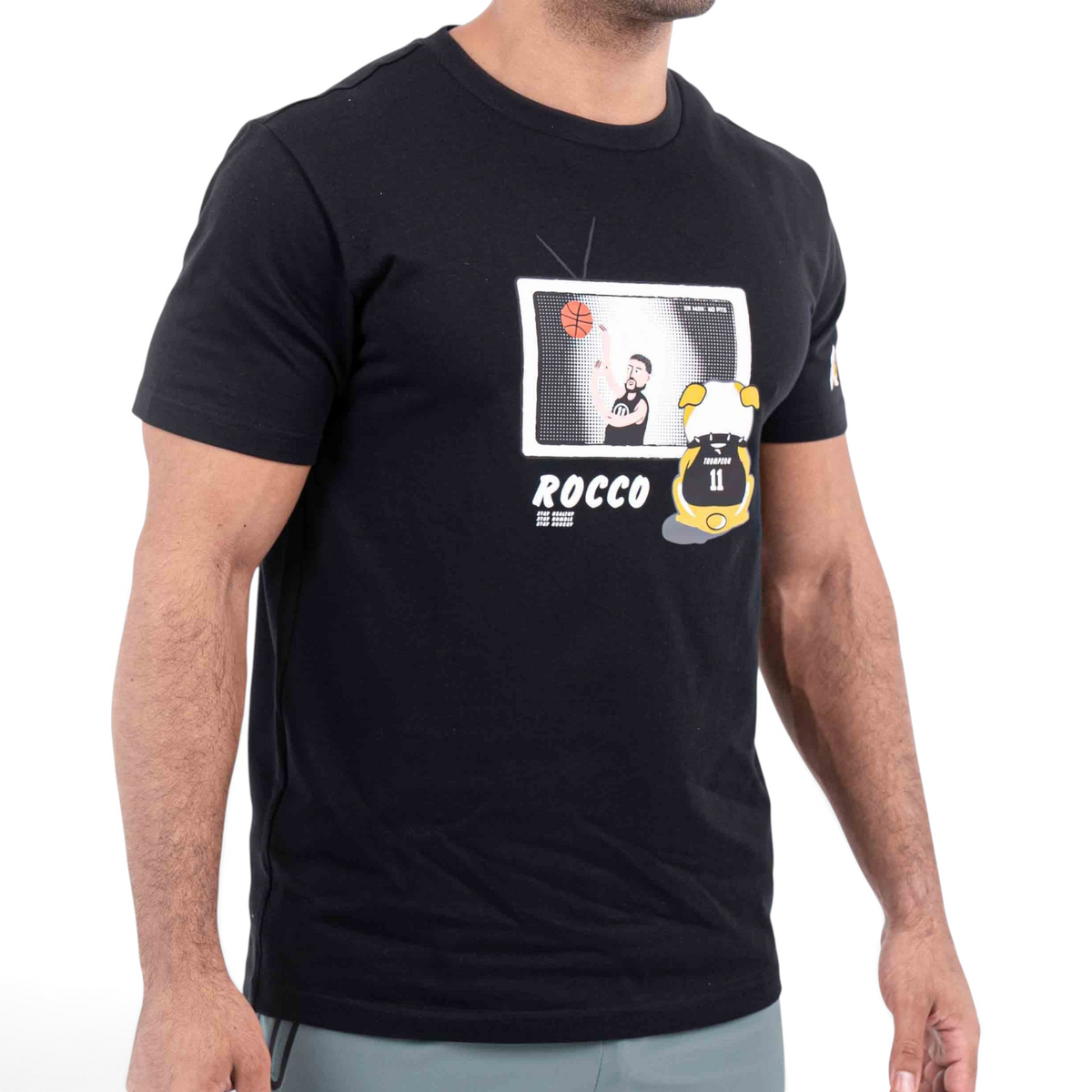 FRG black cotton t-shirt featuring a graphic print of a basketball player on a television screen and Rocco text