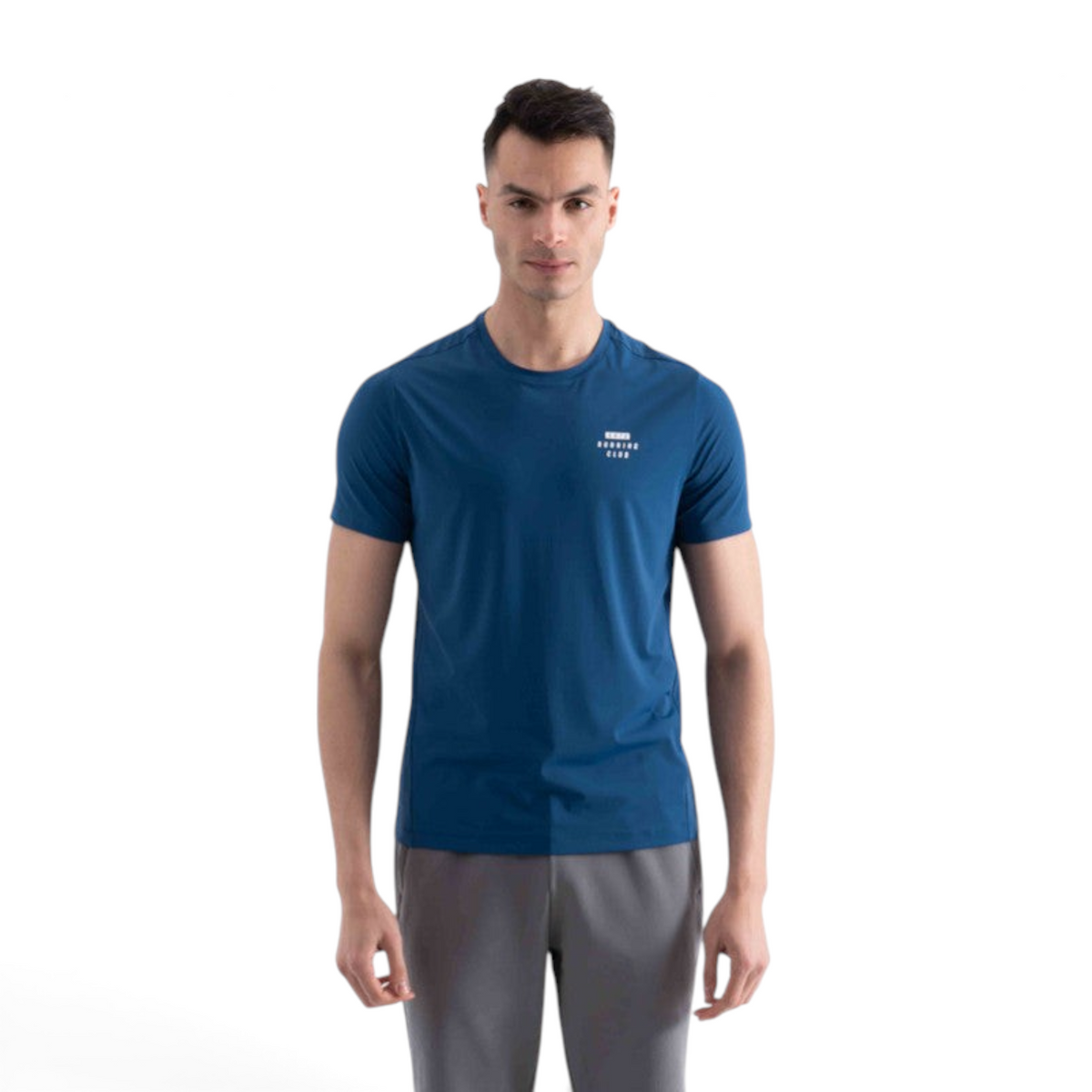 A man wearing a blue FRG short sleeve performance t-shirt with a small white running club logo on the chest
