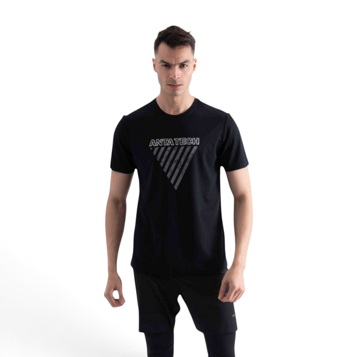 FRG SS TEE in black featuring a white ANTA TECH triangle graphic print on the chest worn by a male model