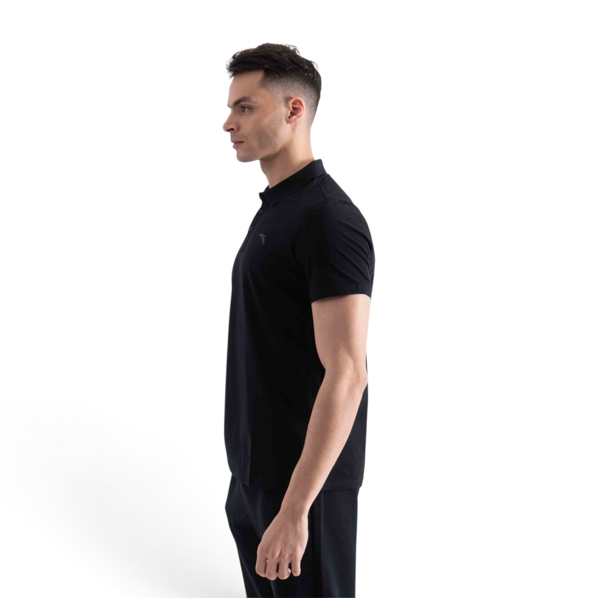 FRG men's black short-sleeve polo shirt worn by a model in a side profile view against a white background