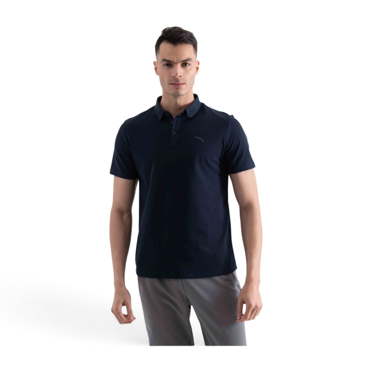 A man wearing a navy blue short-sleeve FRG polo shirt with a classic collar and button placket against a white background