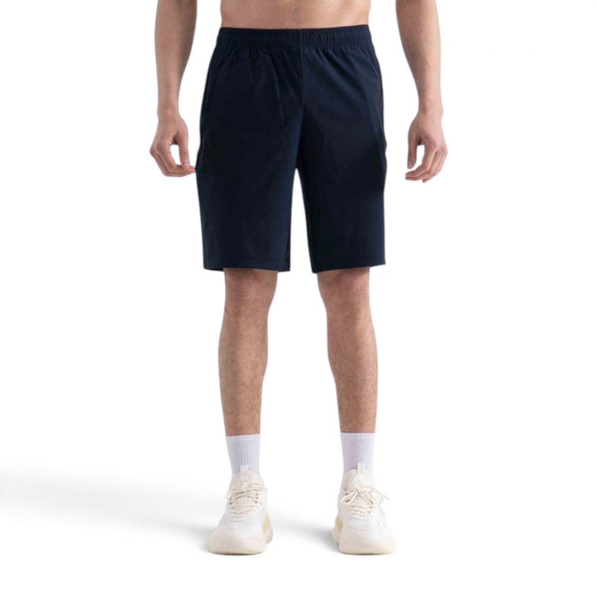 FRG navy blue knit half pants with an elastic waistband worn by a model against a white background