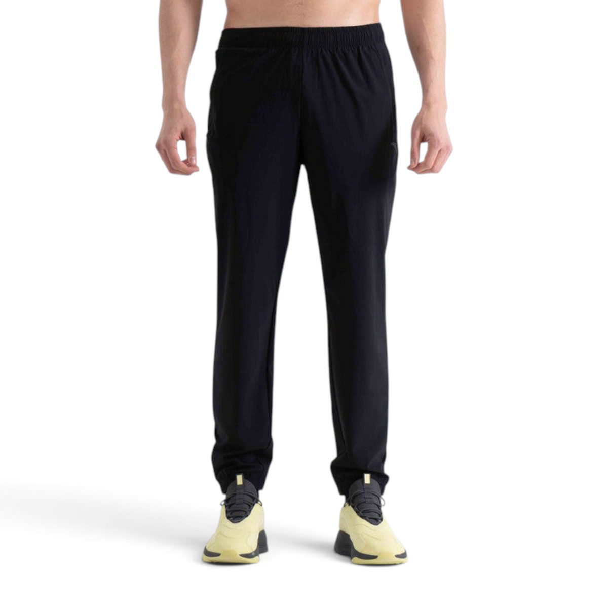 FRG knit track pants in black with an elasticated waistband worn by a model against a plain white background