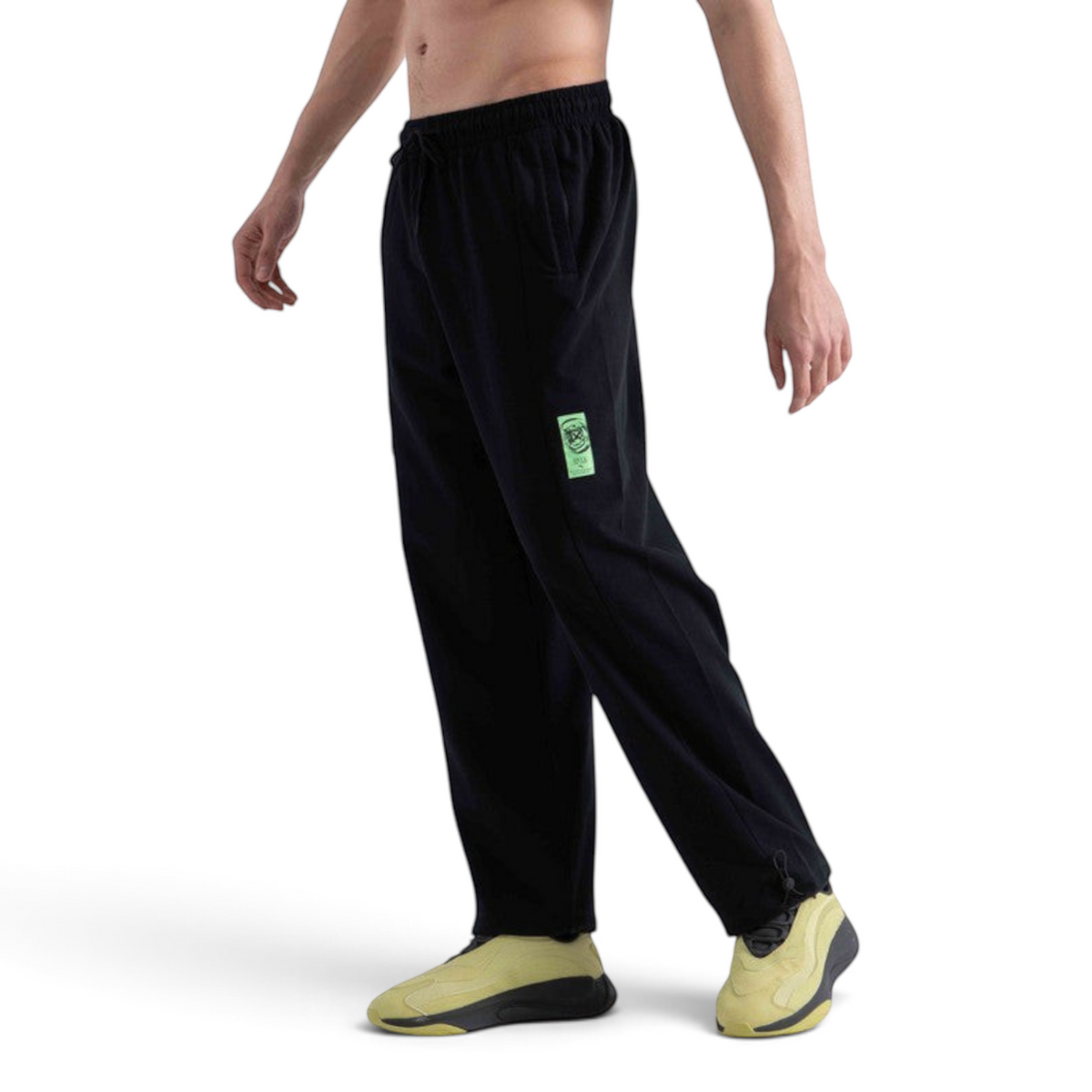 FRG black regular fit knit track pants in cotton blend with a neon green graphic patch and drawstring waist