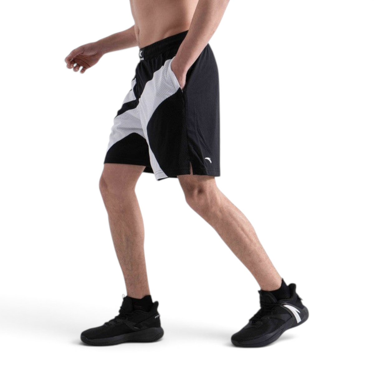 FRG men's black and white basketball game shorts with mesh fabric and side pockets worn by a model