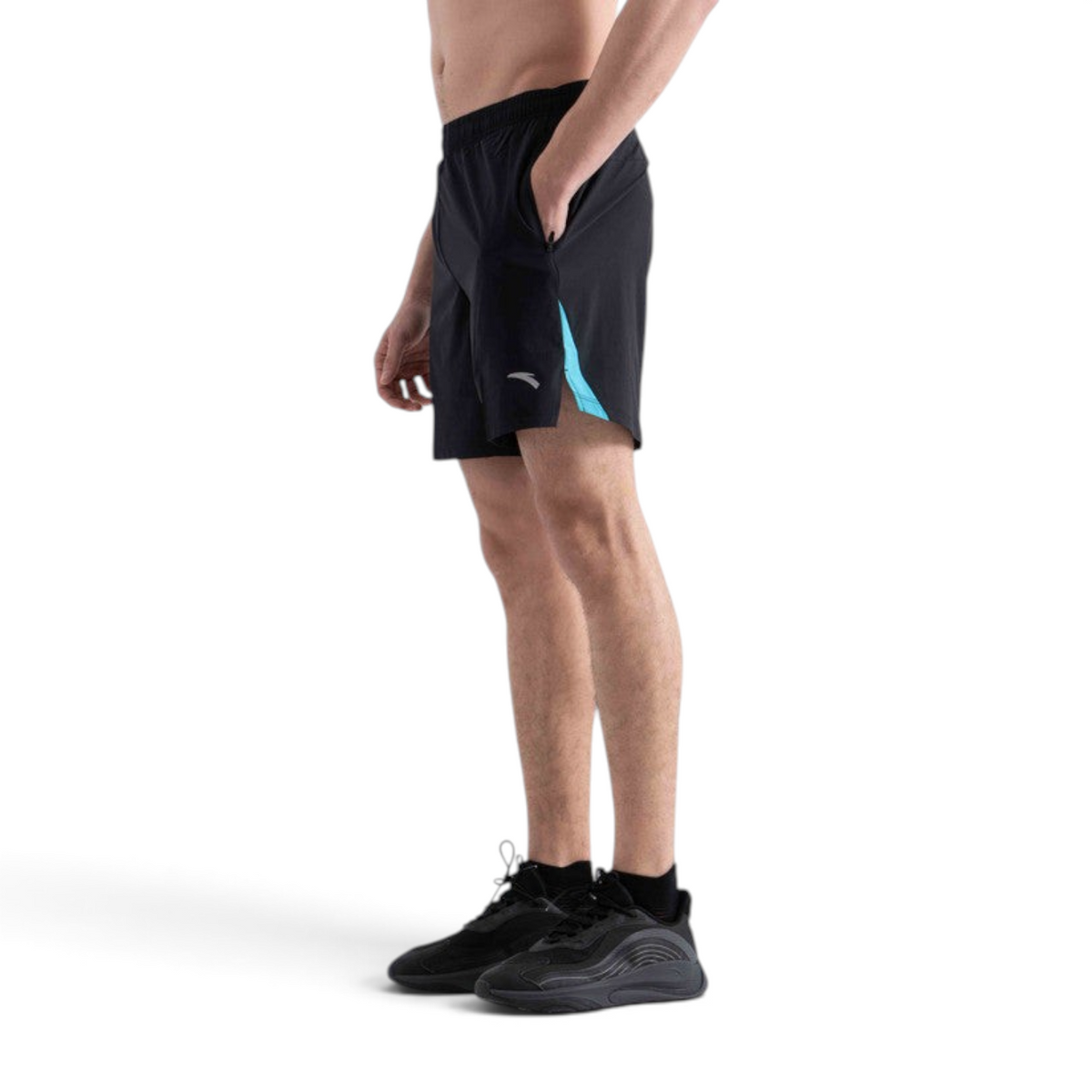 FRG men's black running shorts with blue side panel detail worn by a model in a side profile view