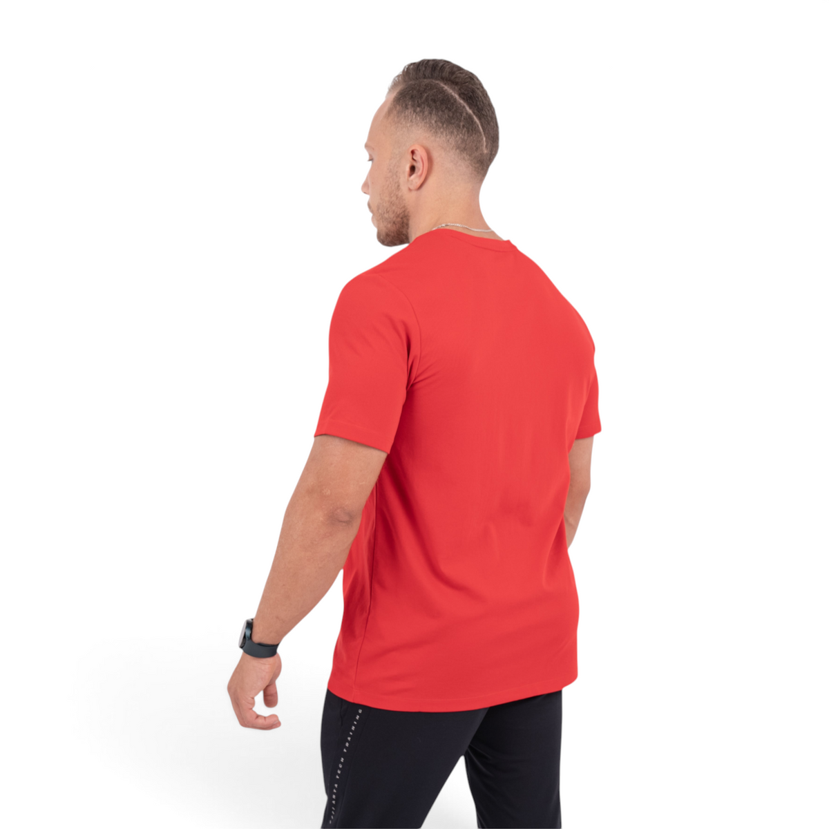 FRG red short-sleeve cross training t-shirt worn by a man from a back view against a white background