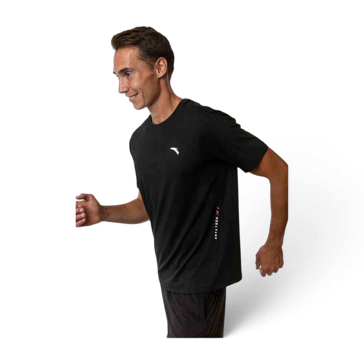A man running in a black FRG short sleeve t-shirt with Antatech branding on the side, isolated on white background.