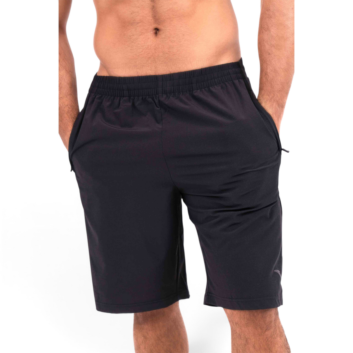FRG black athletic half pants with an elastic waistband and side pockets worn by a man