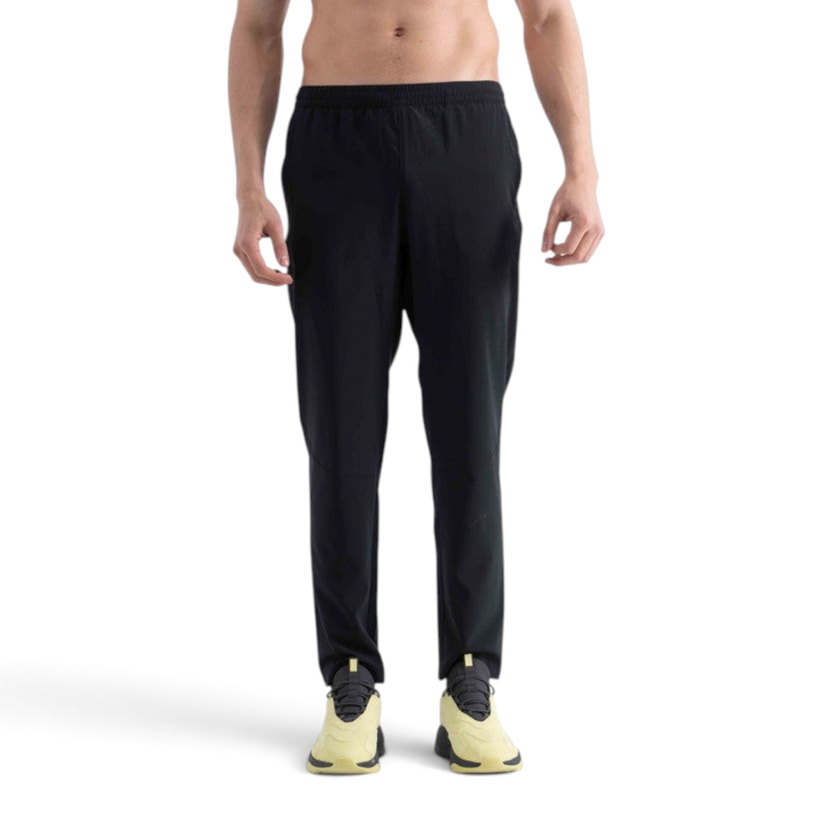 FRG black woven track pants on a shirtless male model, featuring an elastic waistband and athletic fit.