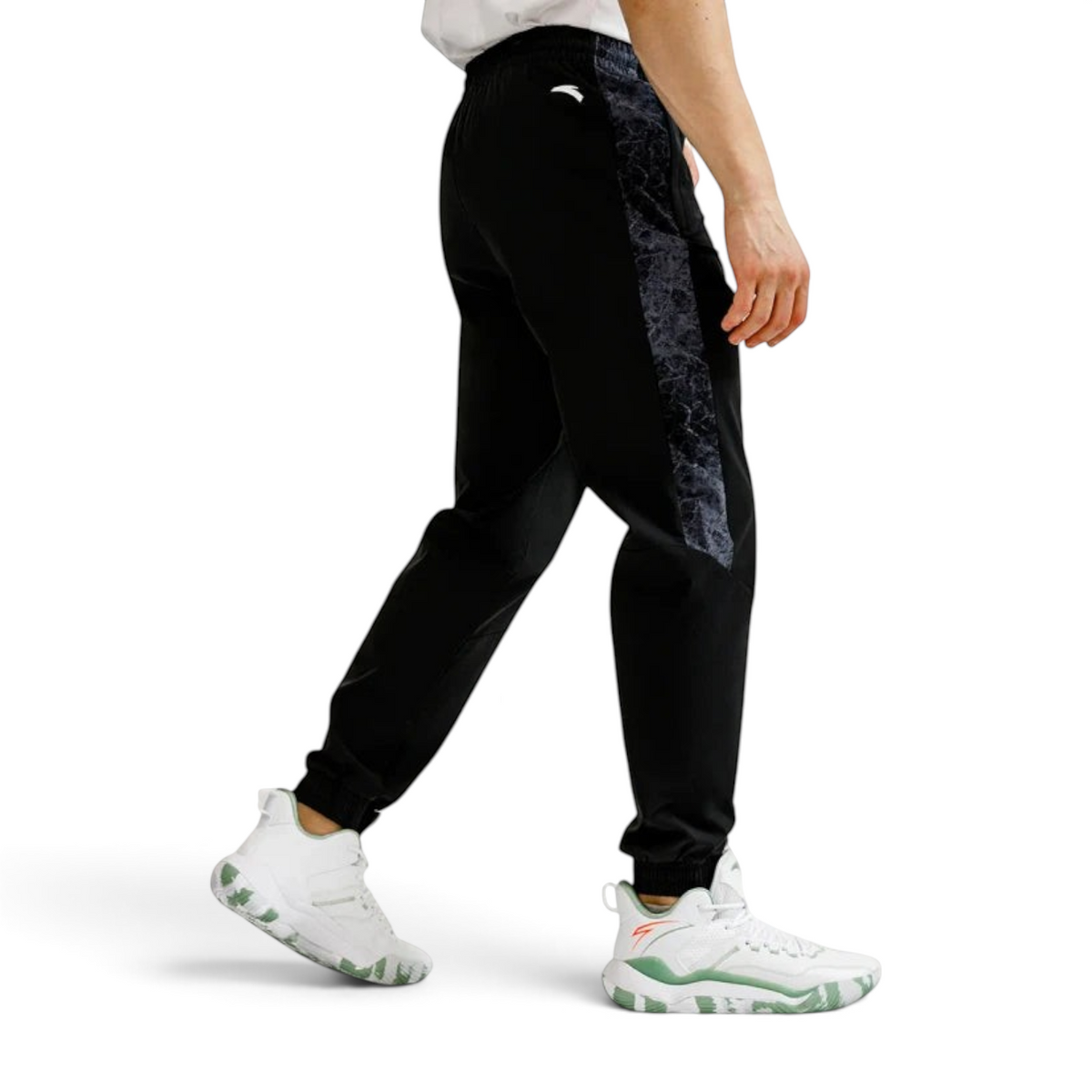 FRG Anta basketball pants in black with grey marble-patterned side panels and elastic cuffs on a male model
