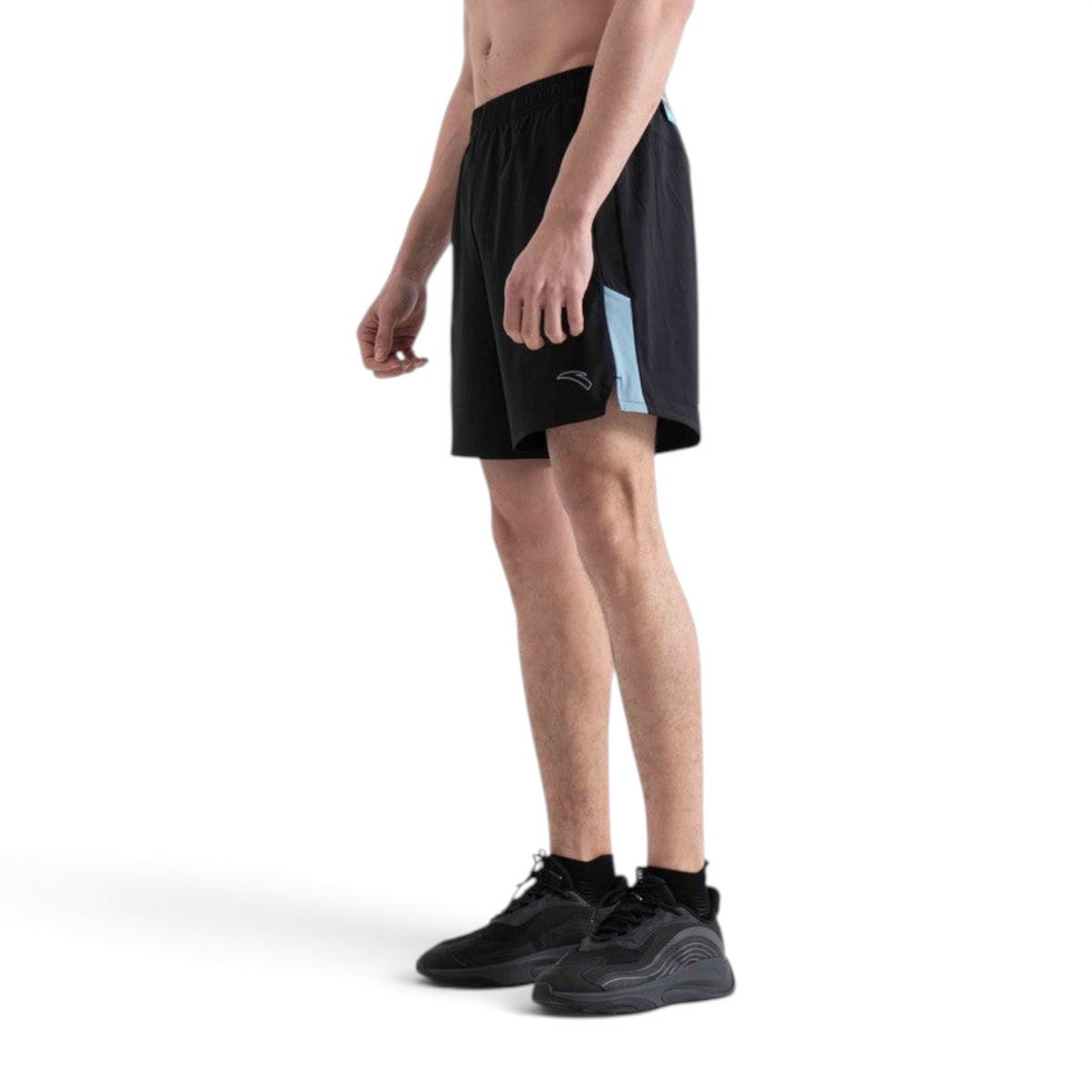 FRG woven athletic shorts in black with light blue side panel detail worn by a man in a studio setting