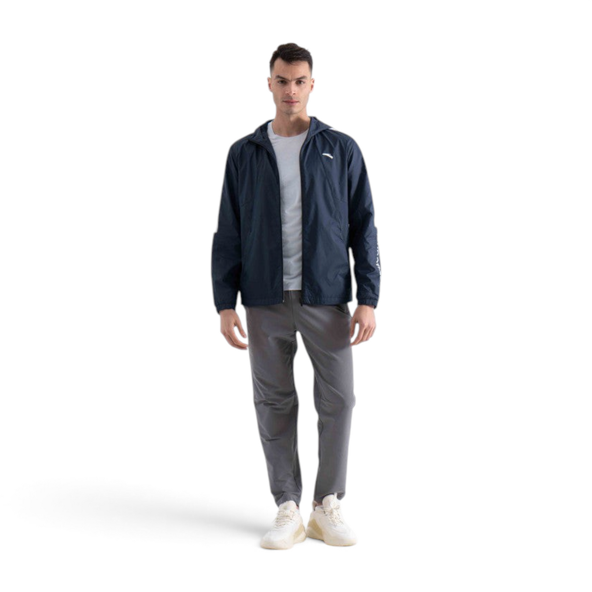 FRG male model wearing a navy blue lightweight hooded sports jacket with white sleeve detailing