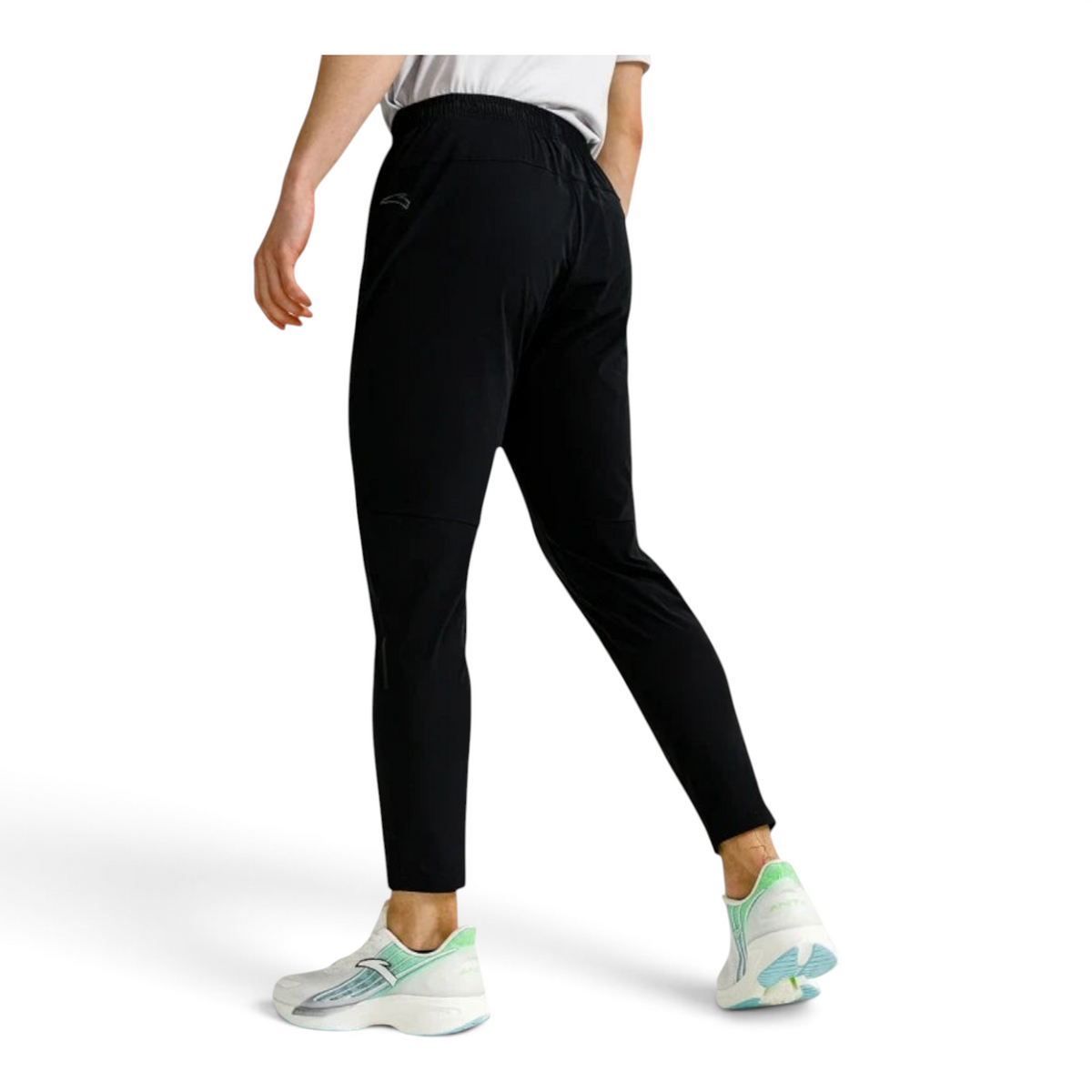 FRG ANTA lightweight black running trousers with reflective details and UV protection worn by a male athlete