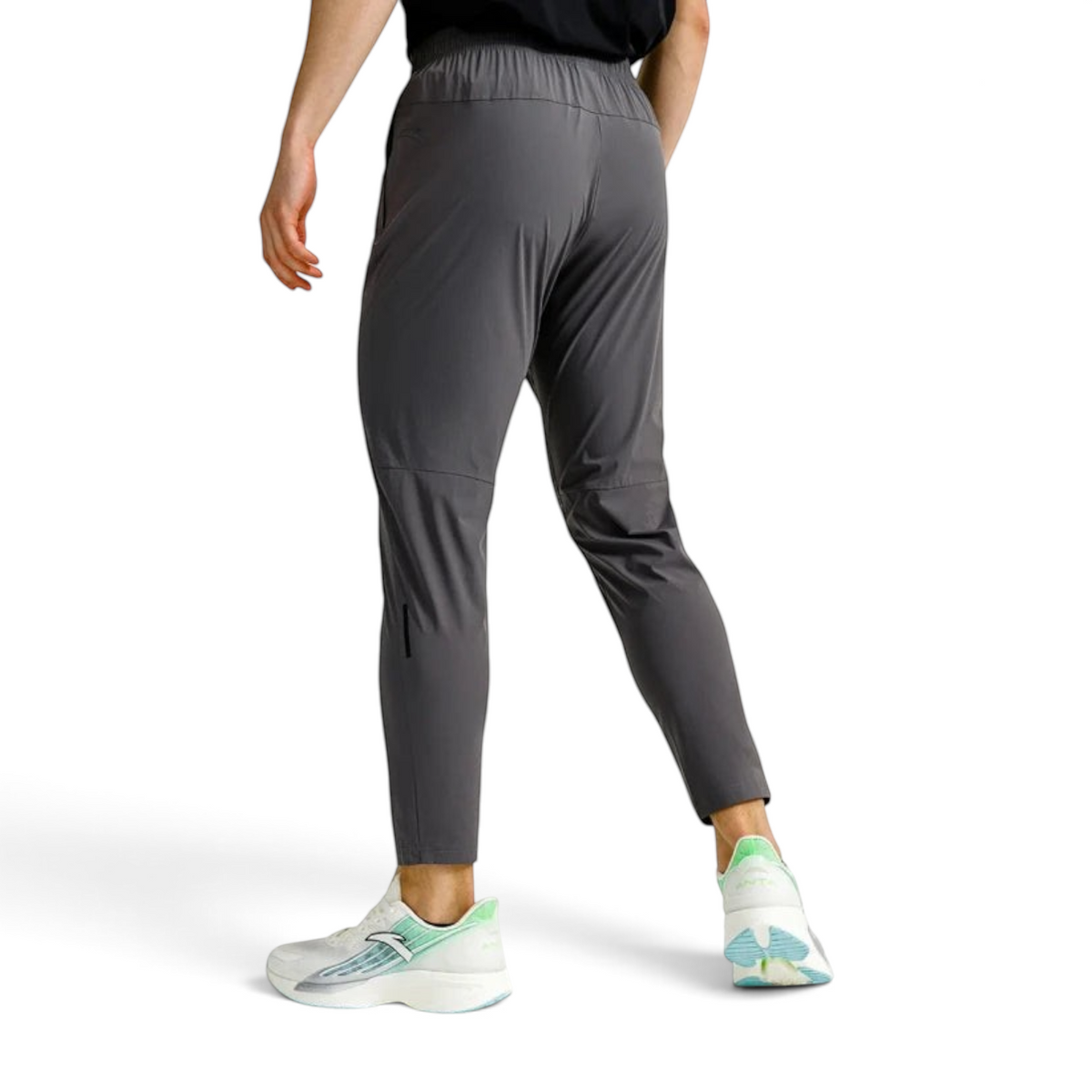 FRG ANTA grey cropped textile running trousers with reflective details and UV protection worn by a male runner