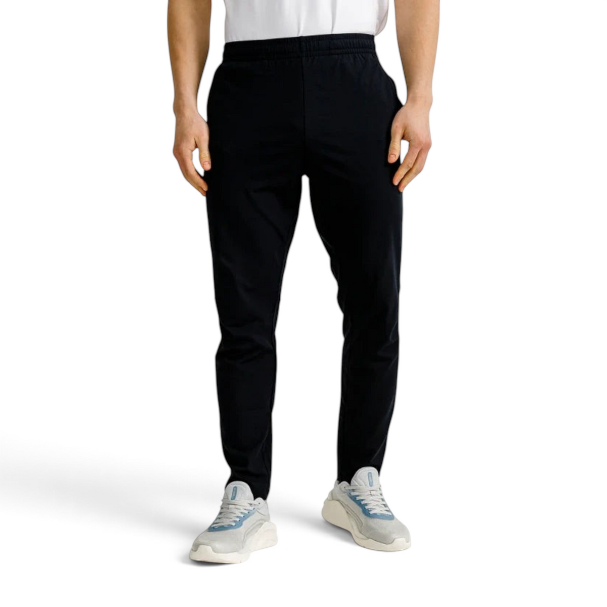 FRG Anta slim-fit black training trousers in Ecocozy fabric with wide elastic waist worn by a male model