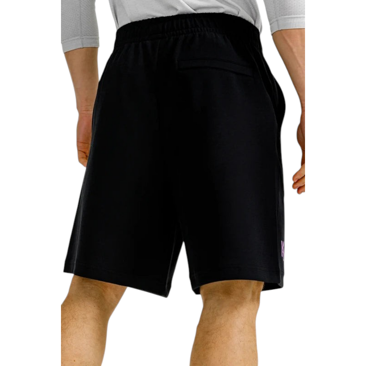 FRG ANTA black knit half pants featuring a comfortable elastic waistband and back pocket, back view on a model.