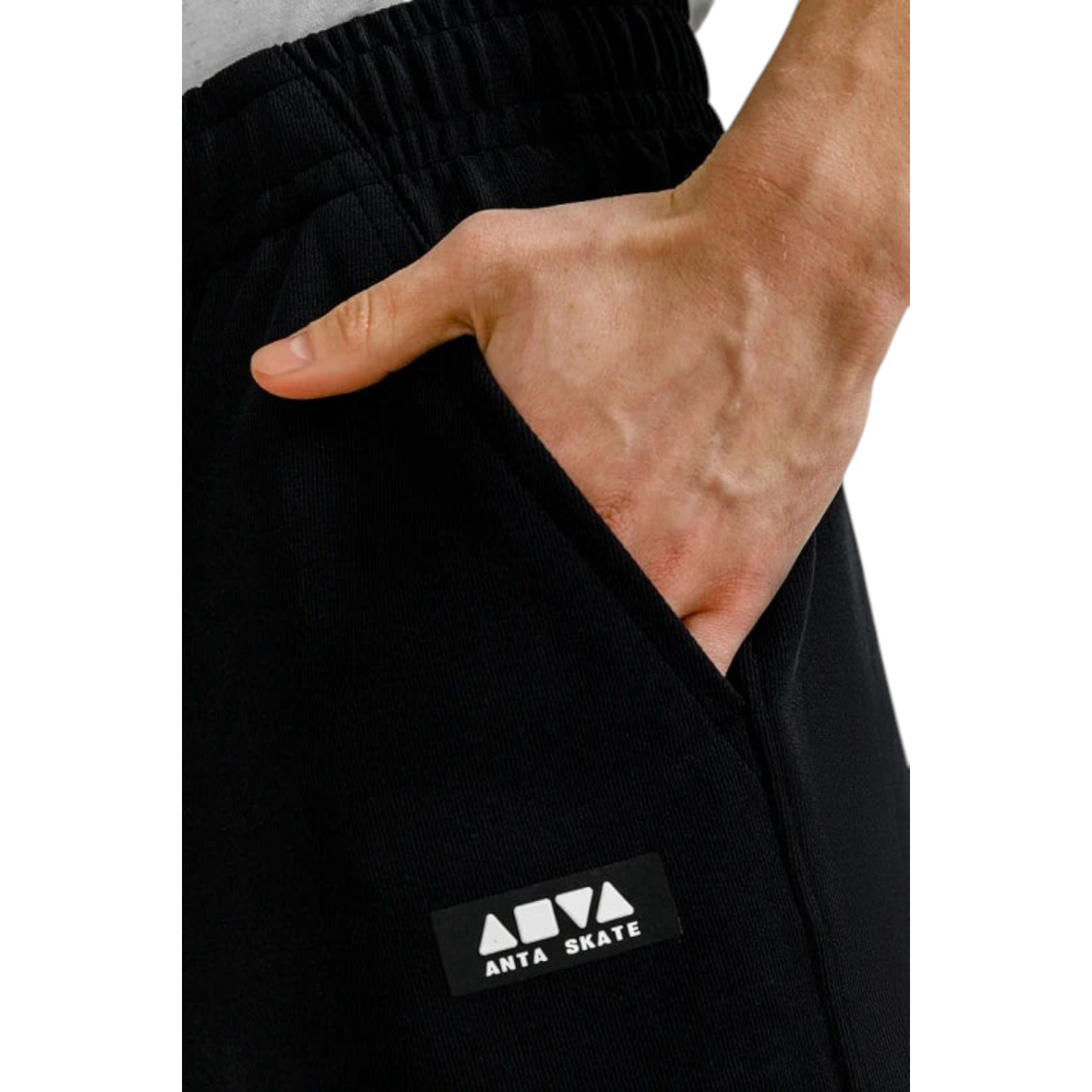 FRG ANTA black knit shorts featuring a side pocket and branded patch detail on a model