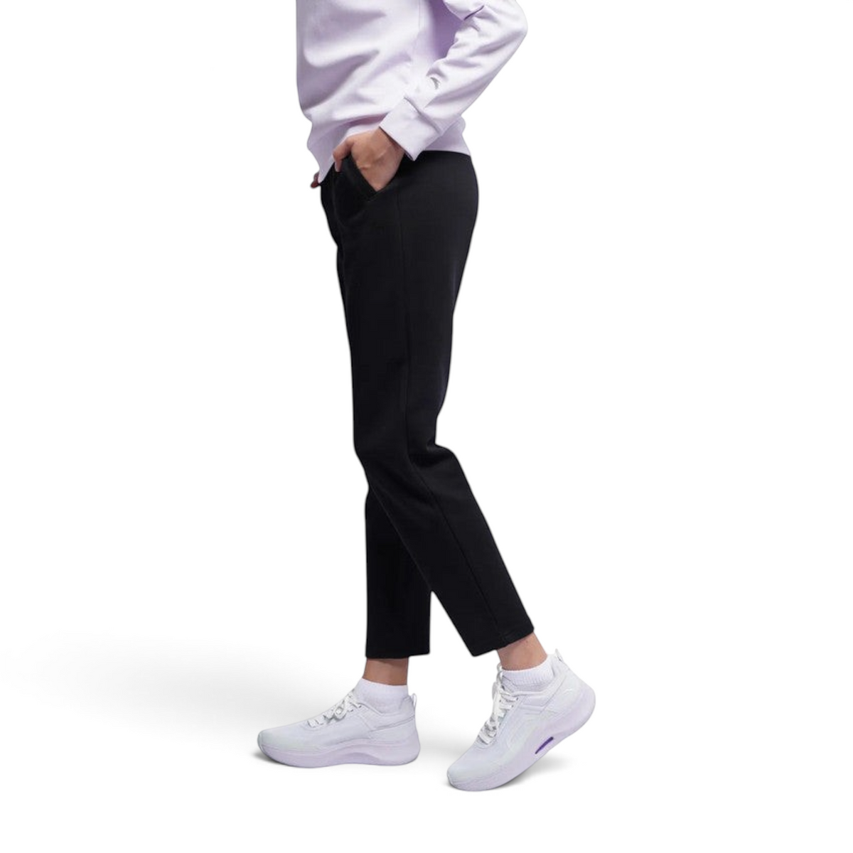 FRG ANTA A-Sports black knit track pants with a tapered fit worn by a model with white sneakers