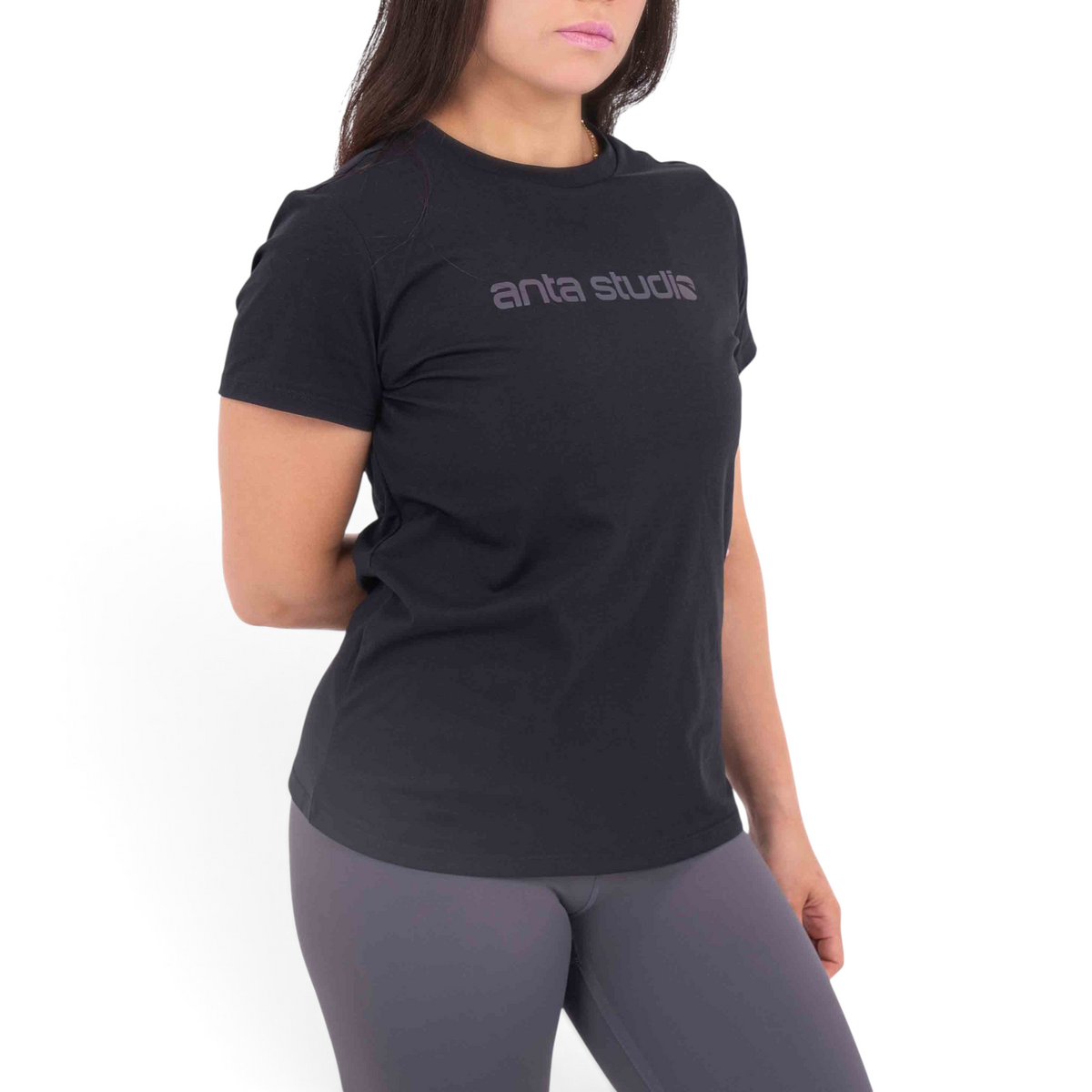 FRG regular fit black cotton blend t-shirt with anta studio logo worn by a woman