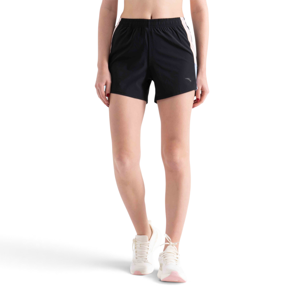 FRG regular fit black athletic shorts with side stripe detail worn by a model with white sneakers