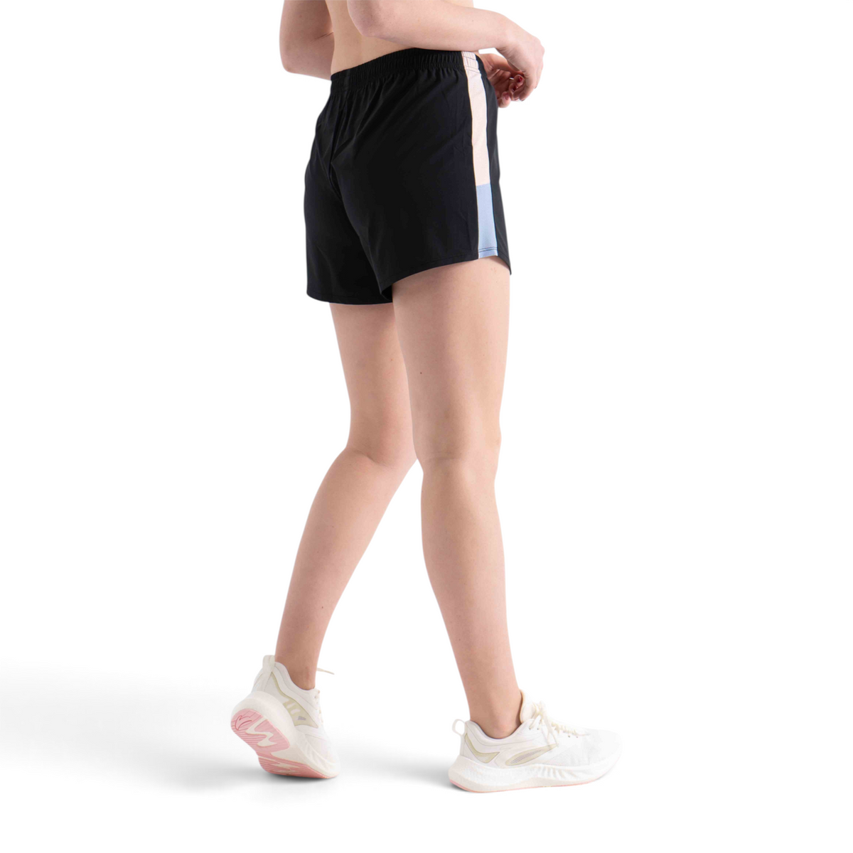 FRG regular fit black athletic shorts with side panel detail worn by a model with white sneakers
