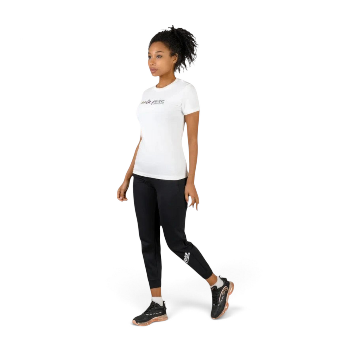 FRG model wearing a snow white ANTA short sleeve cotton blend training t-shirt with black athletic joggers