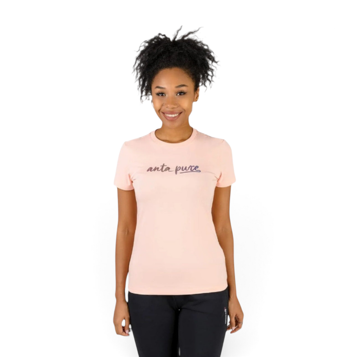 A woman wearing a light pink FRG crew neck t-shirt with anta pure text on the chest against a white background