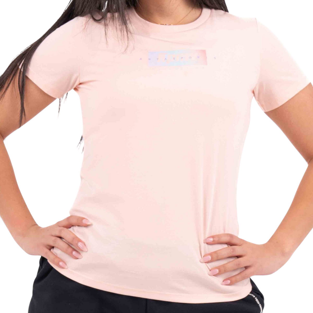FRG light pink crew neck t-shirt with a small rectangular graphic print on the chest worn by a woman