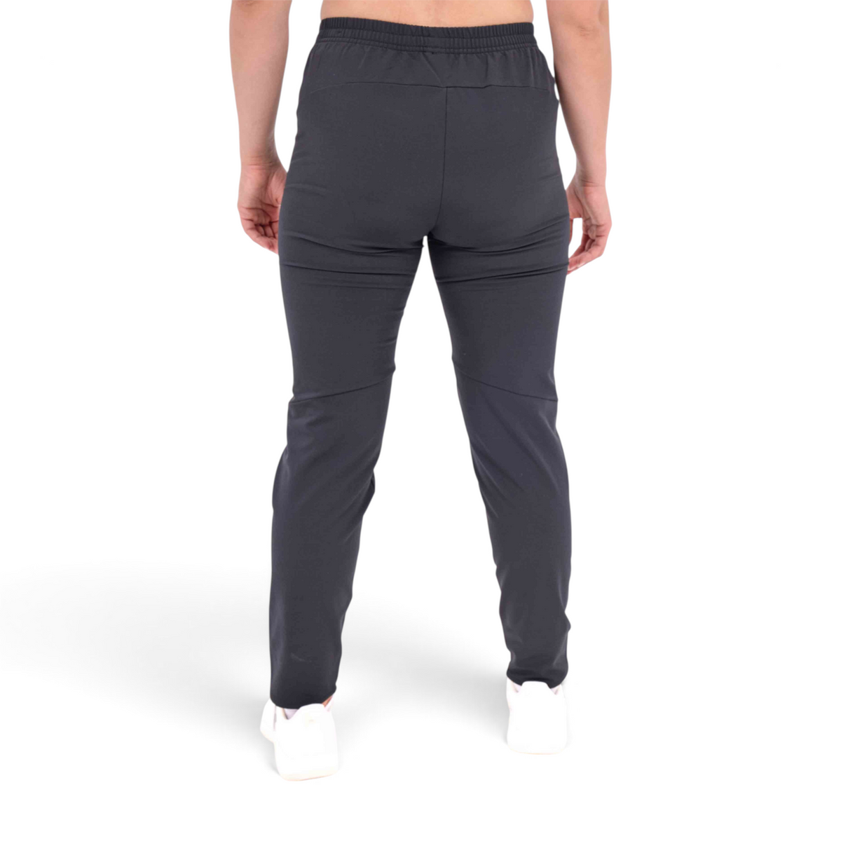 Back view of FRG slim-fit black woven track pants made from a polyester-spandex blend on a person