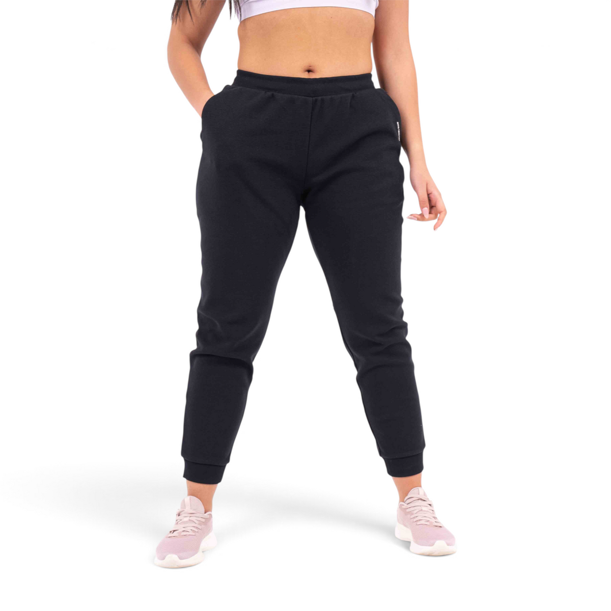 FRG black knit track pants with a regular fit, featuring a comfortable elastic waistband and cuffed ankles.
