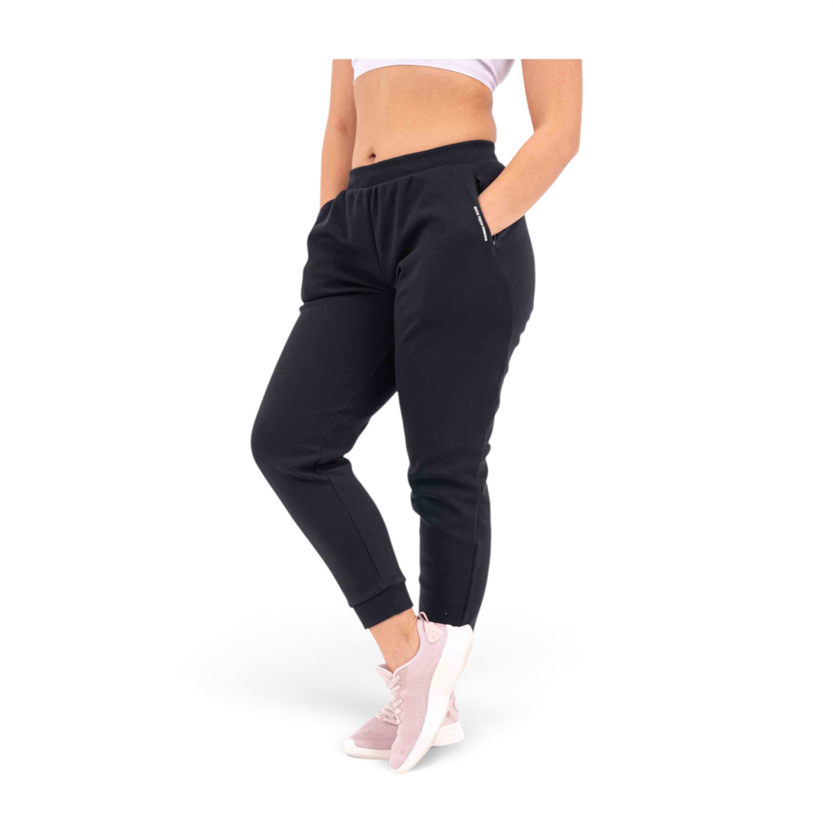 FRG black knit track pants with a regular fit, elastic waistband, and zippered side pockets on a model