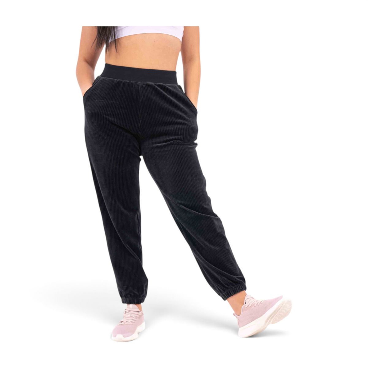 FRG black corduroy knit track pants with a regular fit, elastic waistband, and cuffed ankles on a model